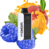 Close-up of a handheld vaping device (white and black pod) surrounded by blue berries and a peach with orange splash in the background, suggesting flavored vape juice
